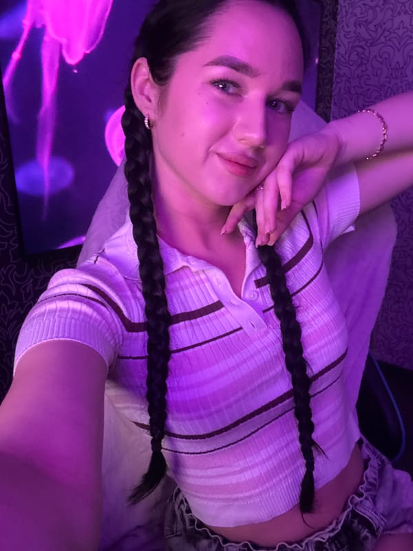 Woman documents makeup session, selfies in Novosibirsk bedroom studio