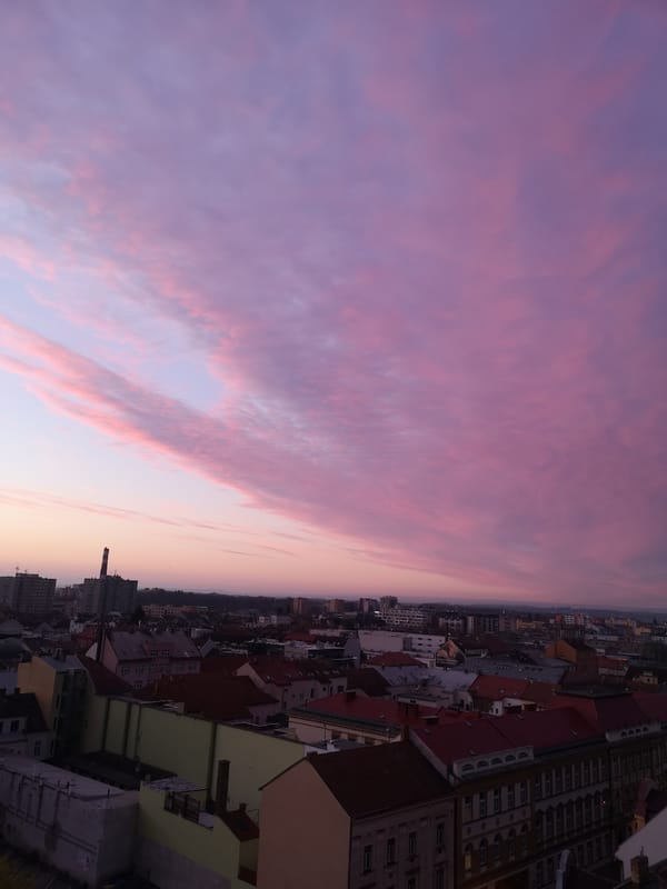 Colorful dawn sky observed over Pardubice cityscape