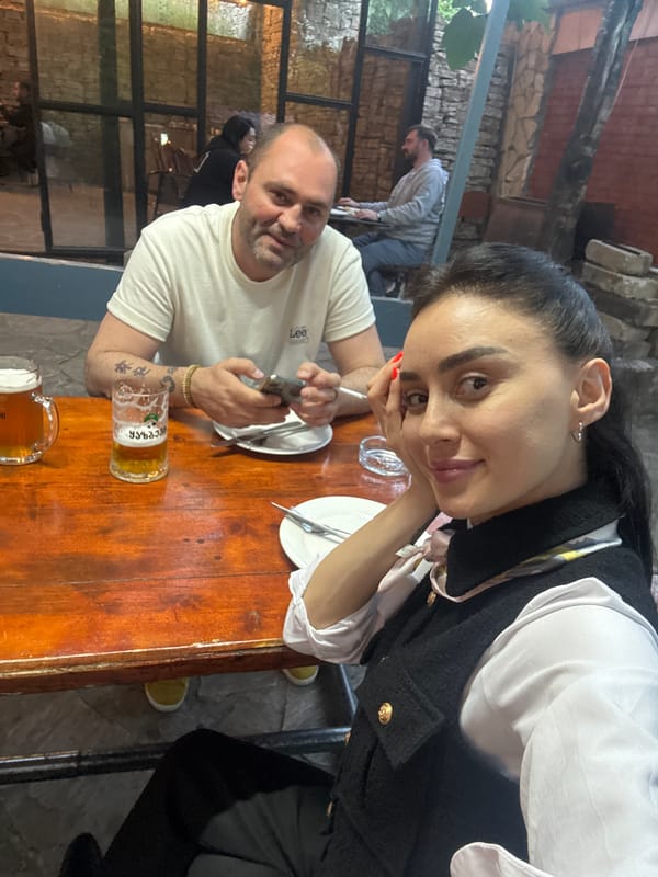 Woman documents casual dining experience in Tbilisi restaurant
