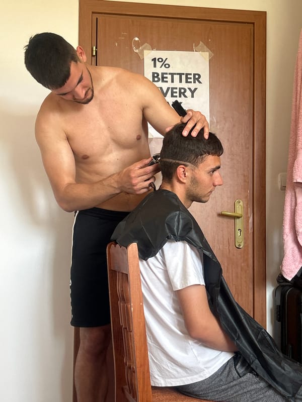 Haircut session documented in Veliko Tarnovo with motivational elements