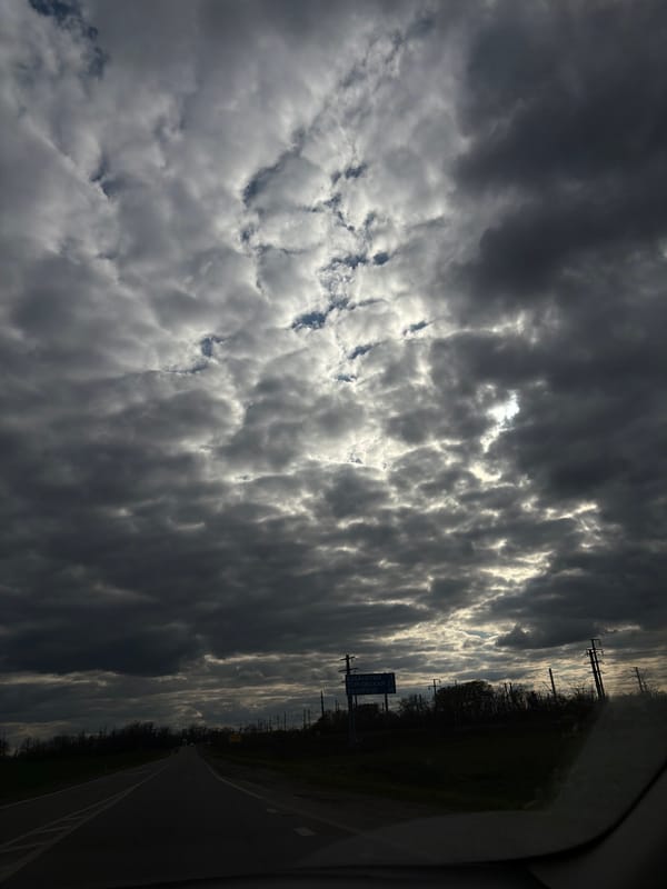Overcast sky documented over rural road in Novopokrovskaya