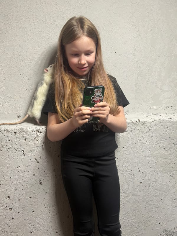 Girl plays with pet rats in Dubovaya home