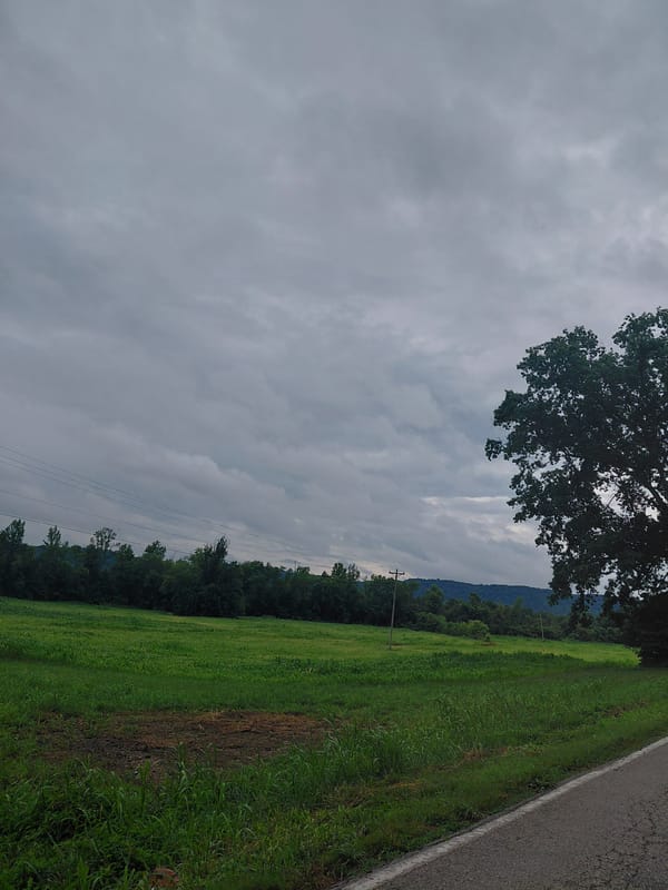 Overcast skies over a green field in rural Bowen, Kentucky