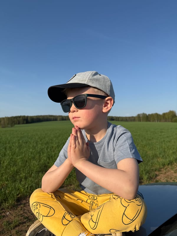 Child plays in rural field near Шумиха, Russia
