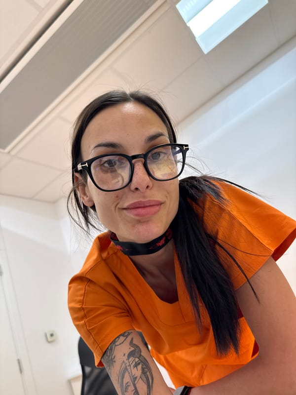 Person in orange jacket observed indoors during early morning