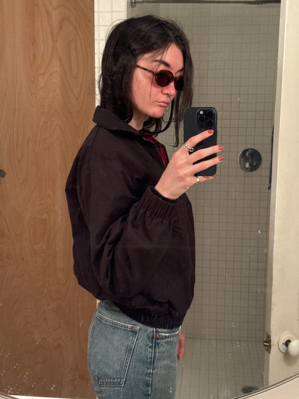 Mirror selfie captured with rotated orientation in New York