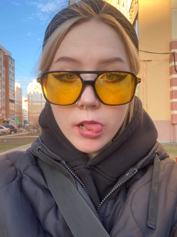 Person takes selfies in residential Izhevsk neighborhood
