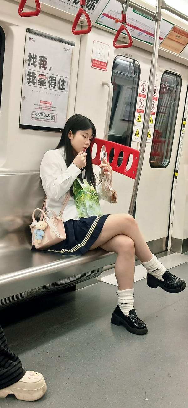 Woman rests on metro train bench in Shapingba District