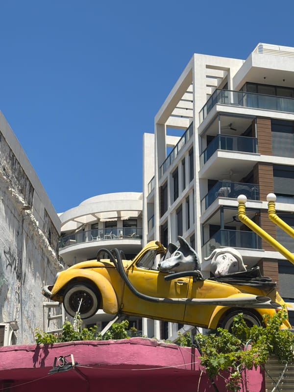 Tel Aviv outdoor scene with modern architecture and art installation
