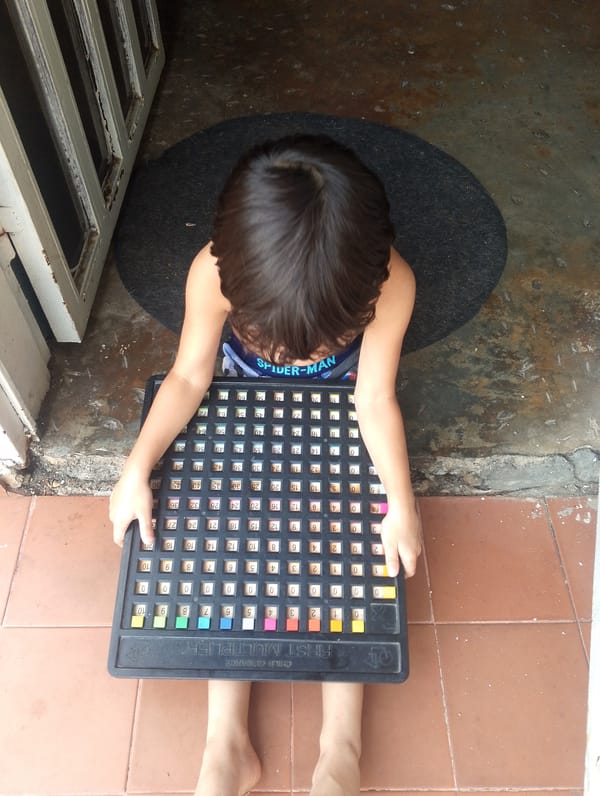 Child plays with educational math toy in San Carlos