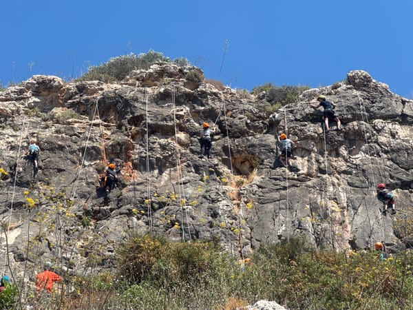 Rock climbers scale cliffs in Hof HaCarmel, Israel