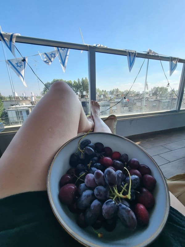 Lazy afternoon in Ramat Gan — balcony, grapes, and downtime