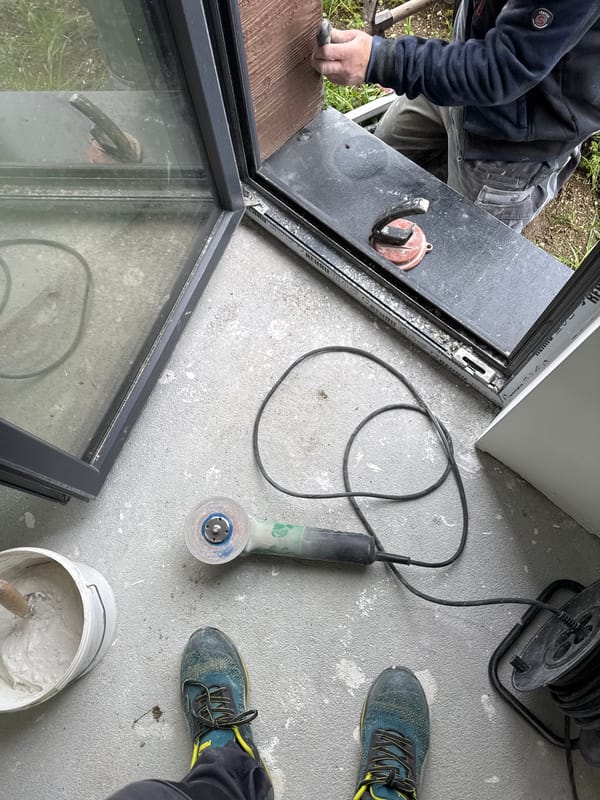 Construction worker installs window panel in Burgas