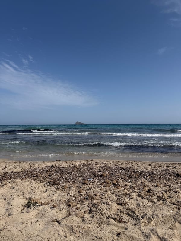 Beach scene with rocky outcrop documented in Finestrat Spain