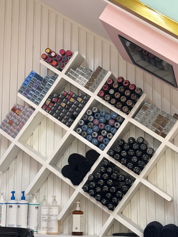 Beauty salon interior documented with products and roses