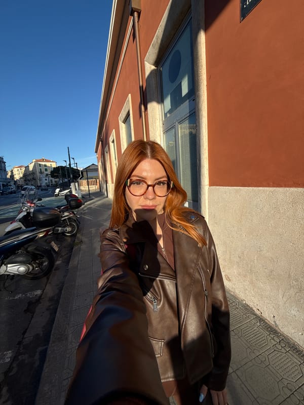 Tourist takes selfies around Sanremo sidewalks during afternoon visit