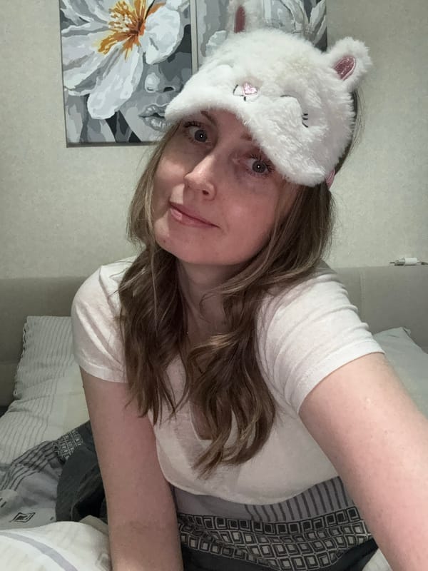 Woman captures selfies, street scene in Chaikovsky, Russia