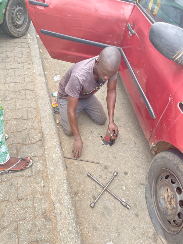 Daily life unfolds in Kagini: repairs, vendors, community interactions