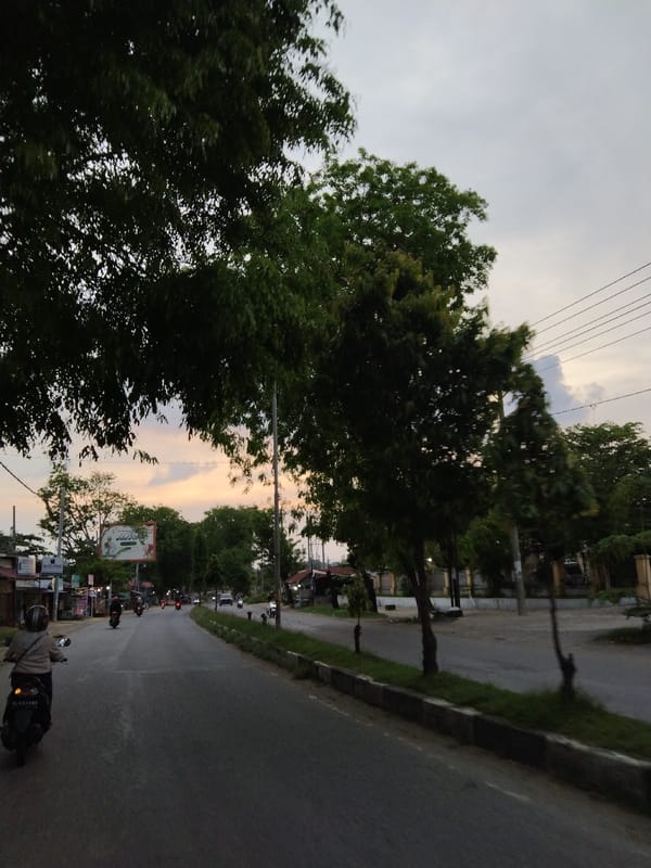 Twilight street scene captured in Lhokseumawe, Indonesia