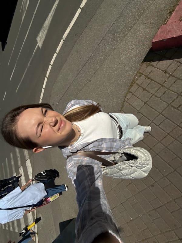Woman Takes Selfie on Belgrade Street Sidewalk