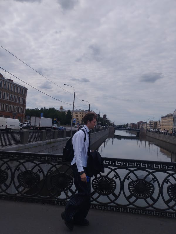 Busy canal-side streets on a cloudy urban afternoon