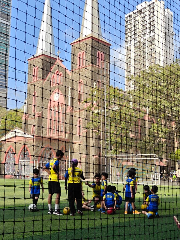 Youth soccer practice session held near historic Mumbai church