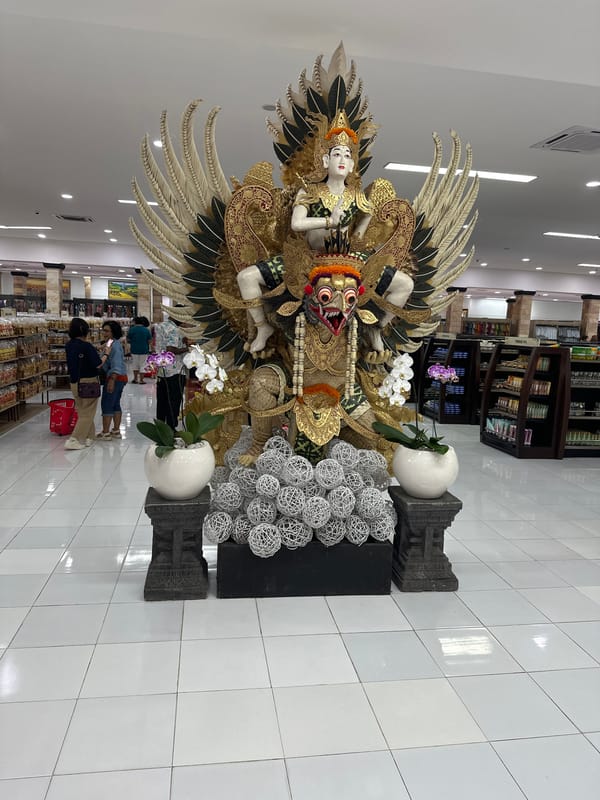 Ornate Garuda Wisnu Kencana statue displayed in Kuta shop