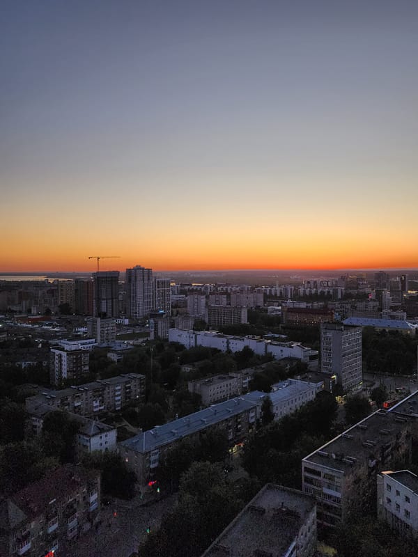 Aerial sunset view captures city skyline during golden hour