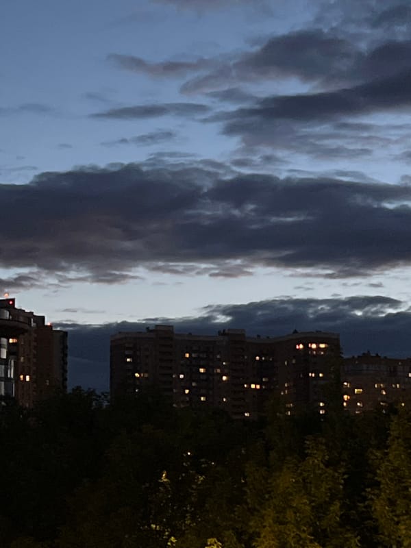 Dusk settles over a residential tower in Pushkino