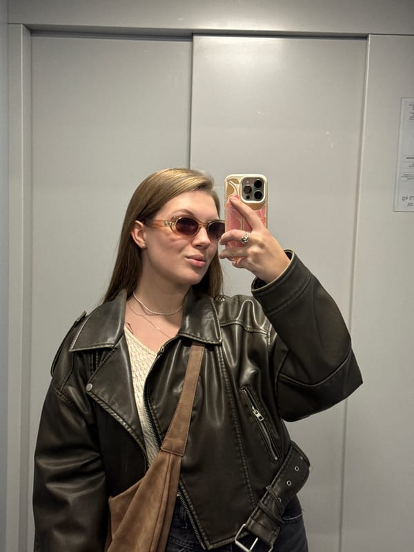 Woman enjoys sushi lunch on spring street in Belgrade