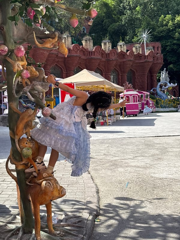 Girl in tiara poses at whimsical park in China