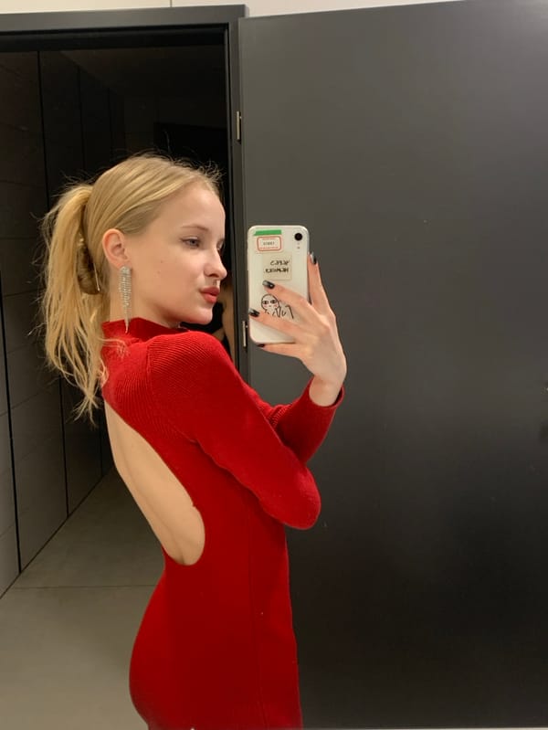 Woman takes mirror selfies in Nowy Targ building