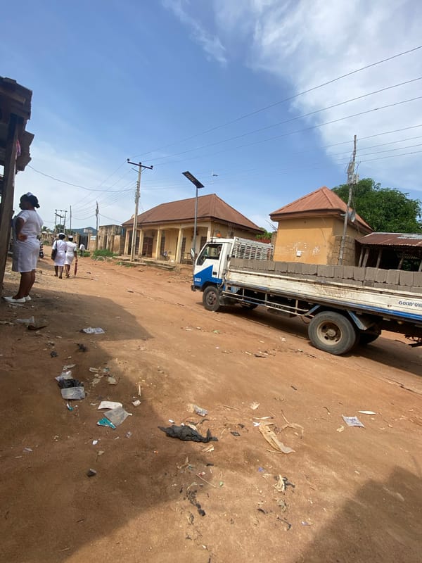 Afternoon foot traffic on Kuson's main dirt road