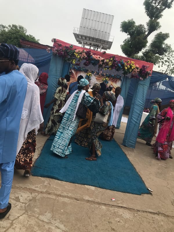 Traditional-dressed women gather at outdoor event in Lokoja, Nigeria