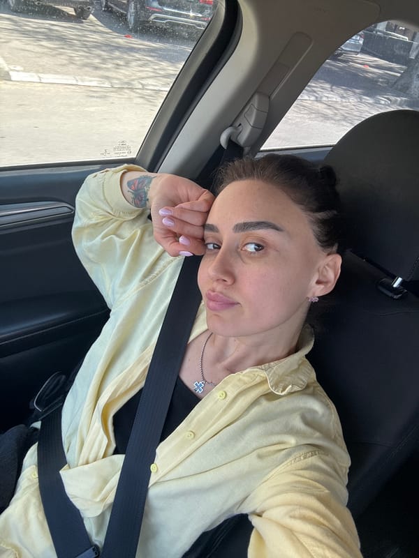 Woman photographed multiple times in car, Tbilisi morning