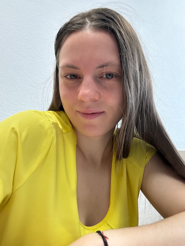 Woman photographed multiple times indoors in Chaikovsky, Russia
