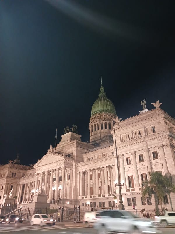 Nighttime scenes captured around illuminated Argentine Congress building in Buenos Aires