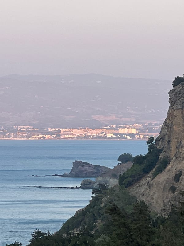 Rocky cliffs and calm sea at dusk, Neo Chorio, Cyprus