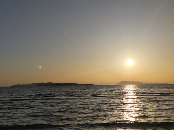 Coastal sunset and beach activities documented by witnesses