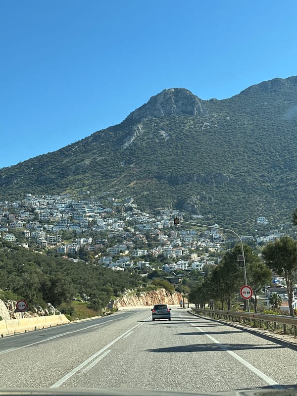 Morning traffic captured on hillside road in Kaş, Turkey