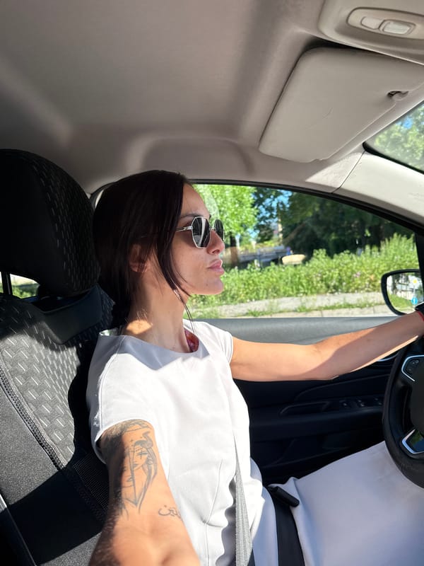 Woman rests in driver's seat in Pleven, Bulgaria