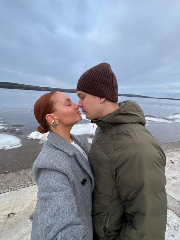 Couple shares intimate moment by water in Chaikovsky
