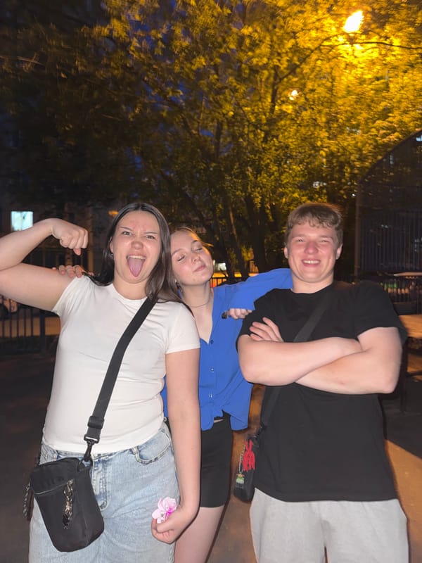 Young adults pose for nighttime photos in Perm