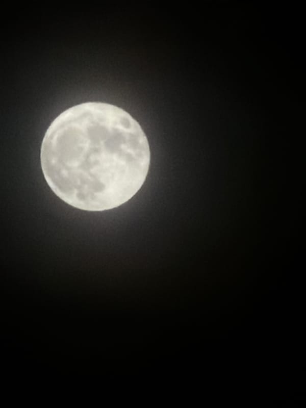 Full moon photographed over Coquitlam morning sky