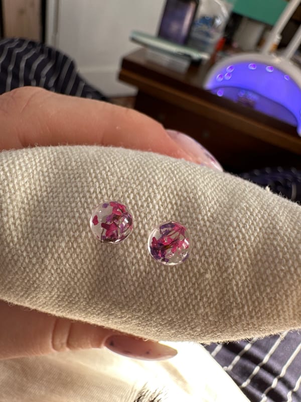 Bulgarian artisan crafts floral resin jewelry in afternoon session
