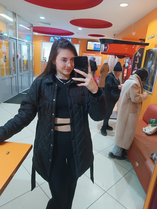 Woman documents day through selfies in multiple indoor locations