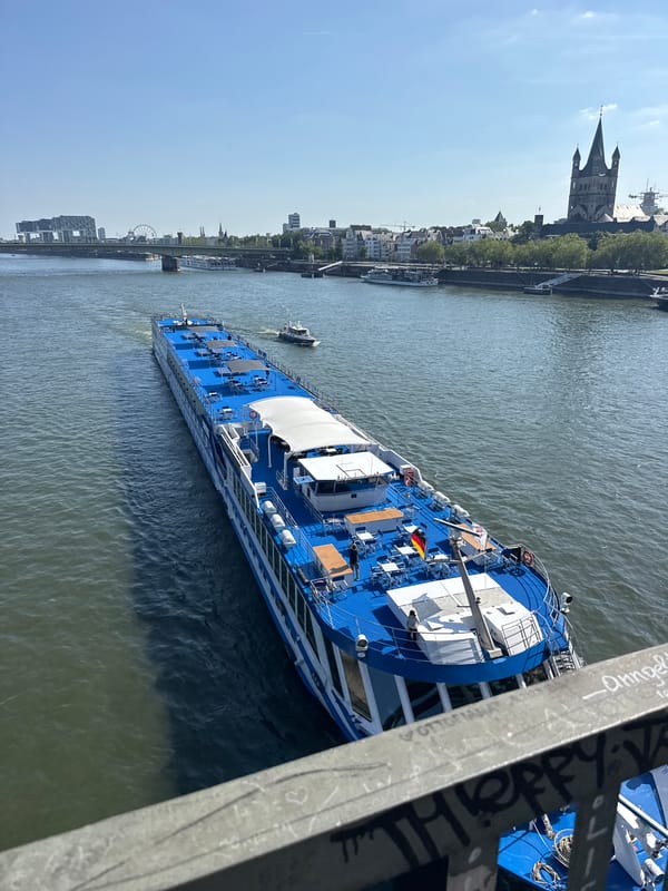 Rhine riverfront scenes: cruise ship, love locks, Cologne skyline