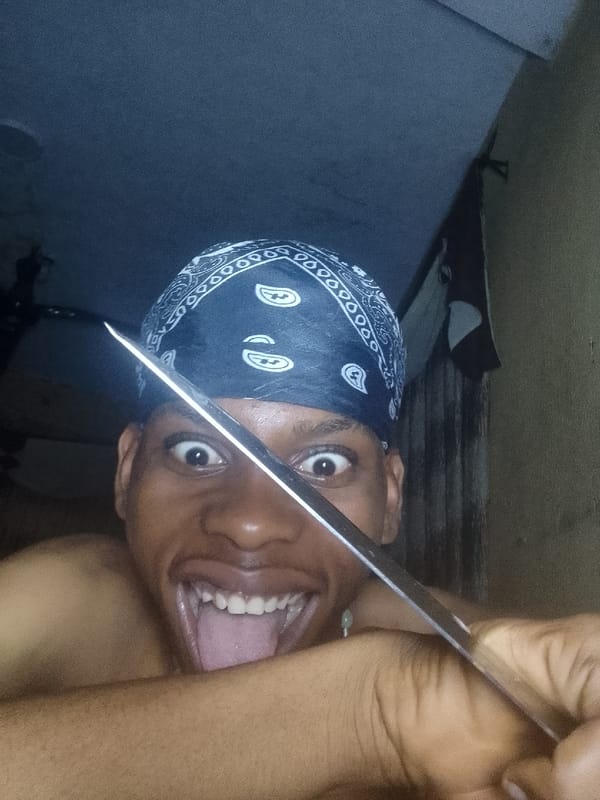 Knife performance artist documented in Nkpor, Nigeria