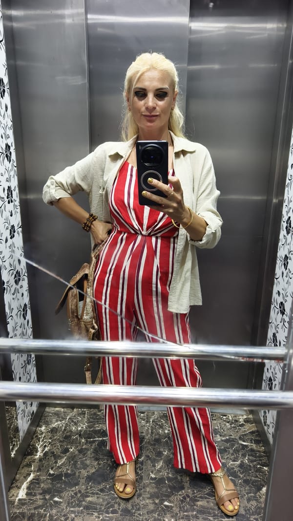 Elevator selfie in Kuşadası, bold stripes and gold accessories