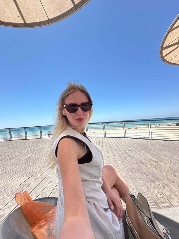 Morning stroll documented along Tel Aviv's sunny coastal promenade